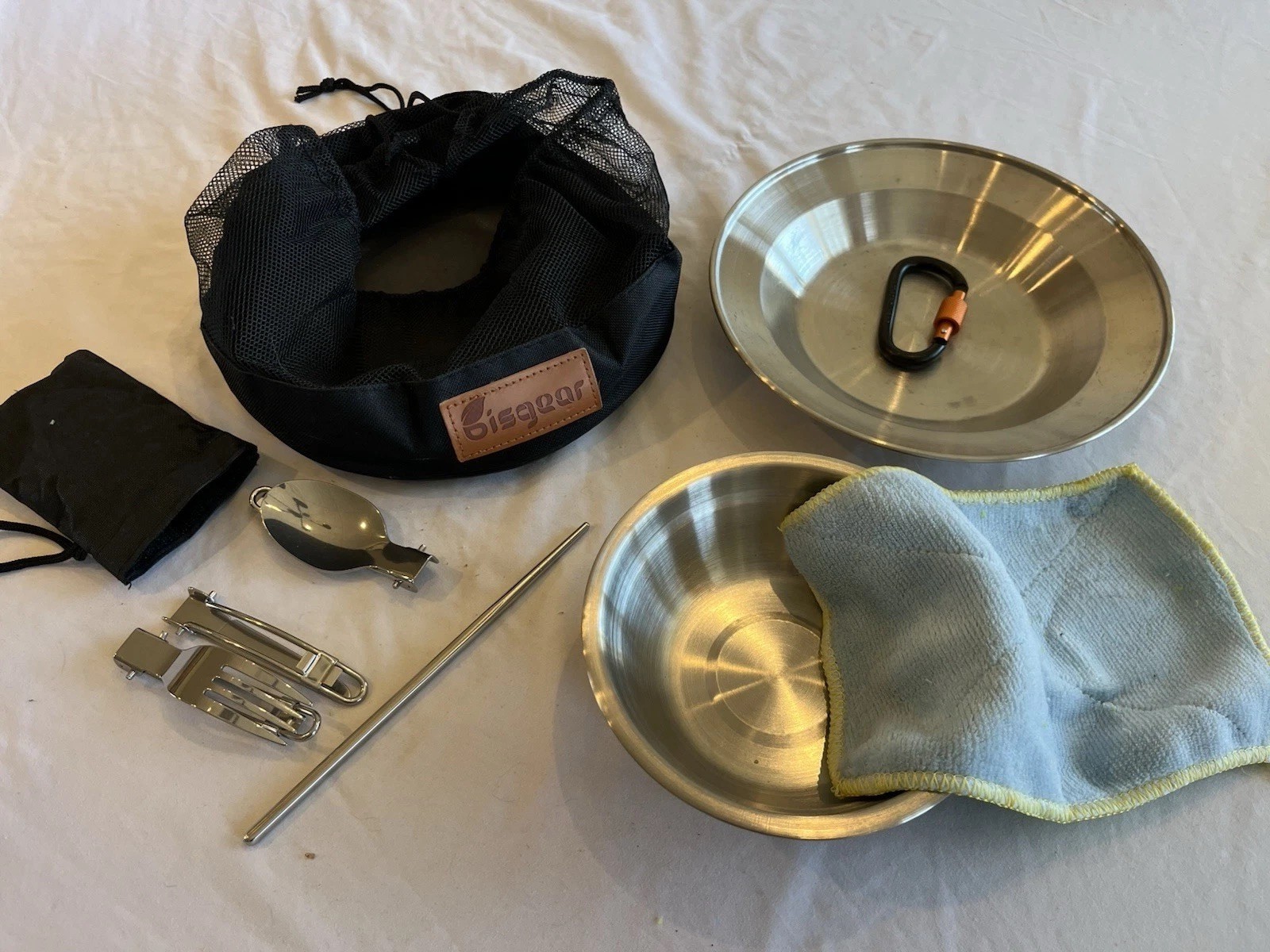 Bisgear stainless steel camping cookware and dinnerware mess kit.